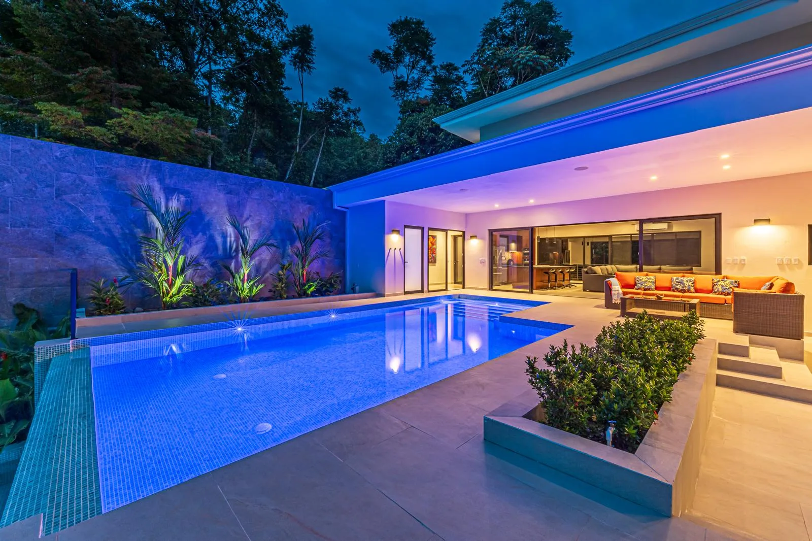 Evening view across the pool toward the open-plan living areas