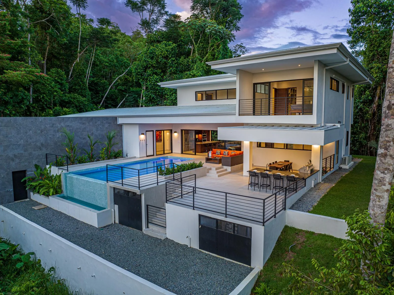 Elevated daytime view of the pool terrace and surrounding jungle