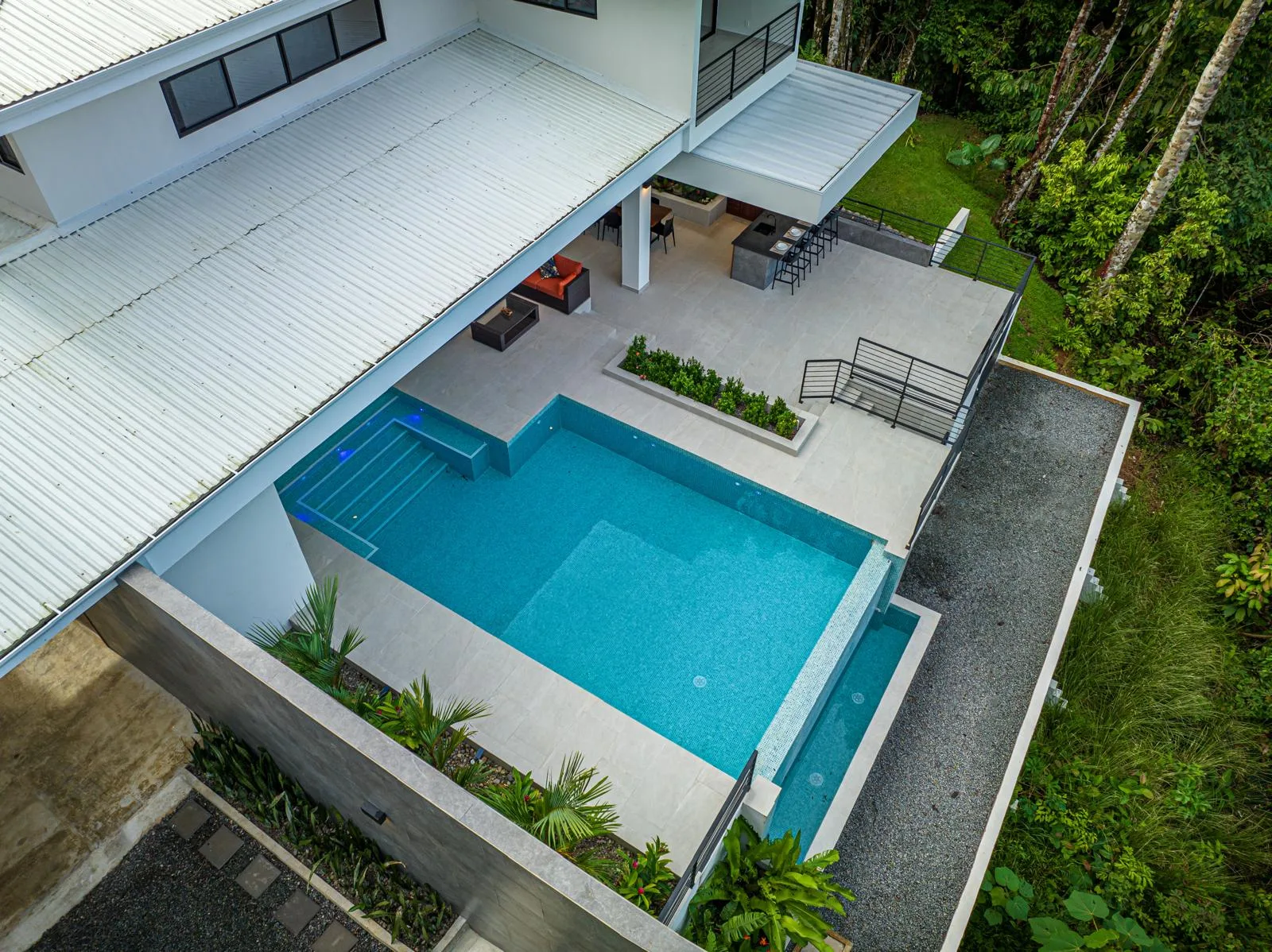 The residence set into the hillside jungle